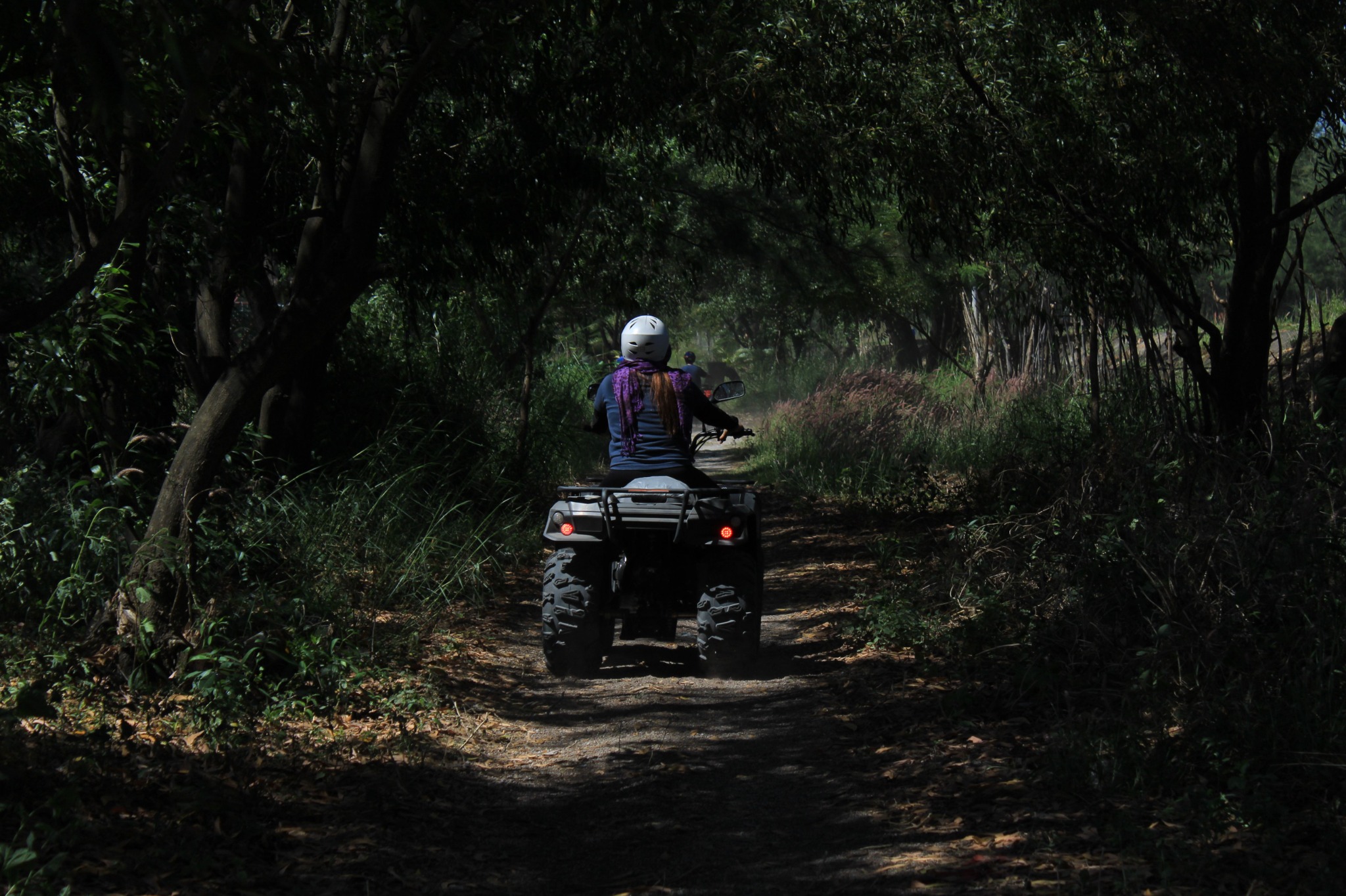 Two ATV riders on a sandy forest trail near Lakewood, Wisconsin