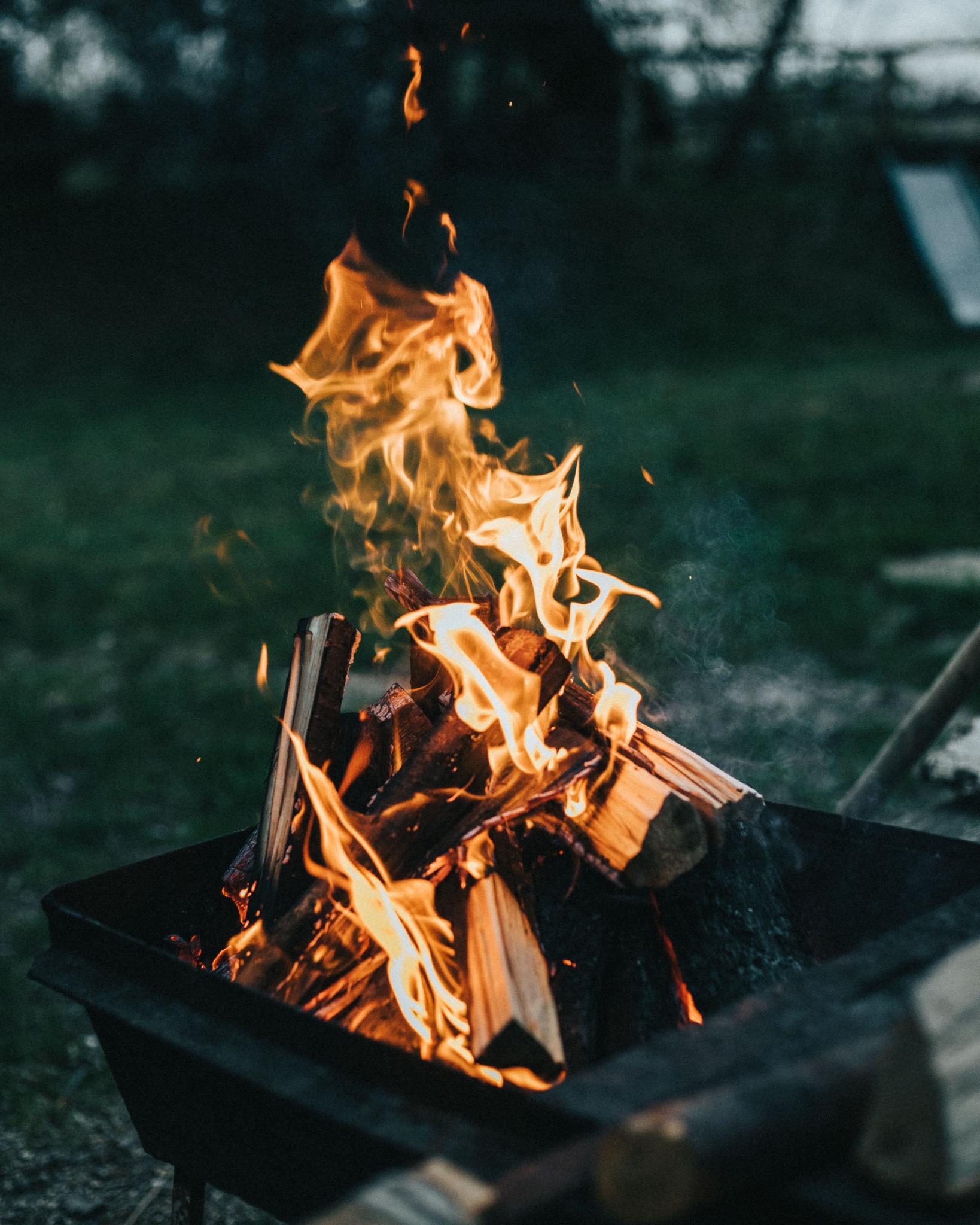 A campfire burning at dusk