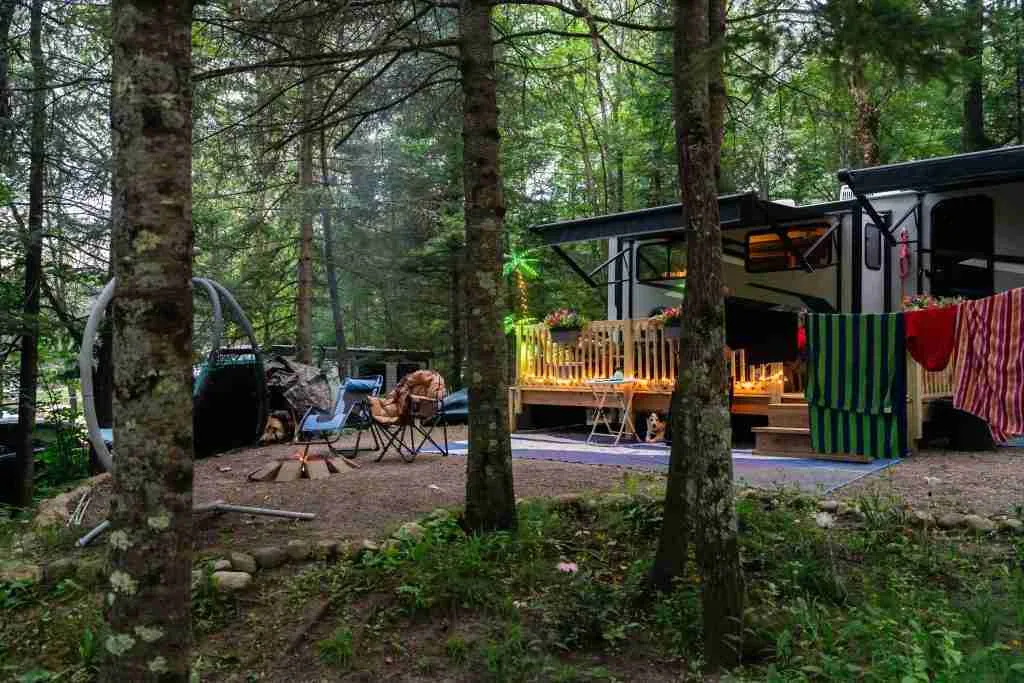 Monthly RV site with a deck and shaded campsite setup